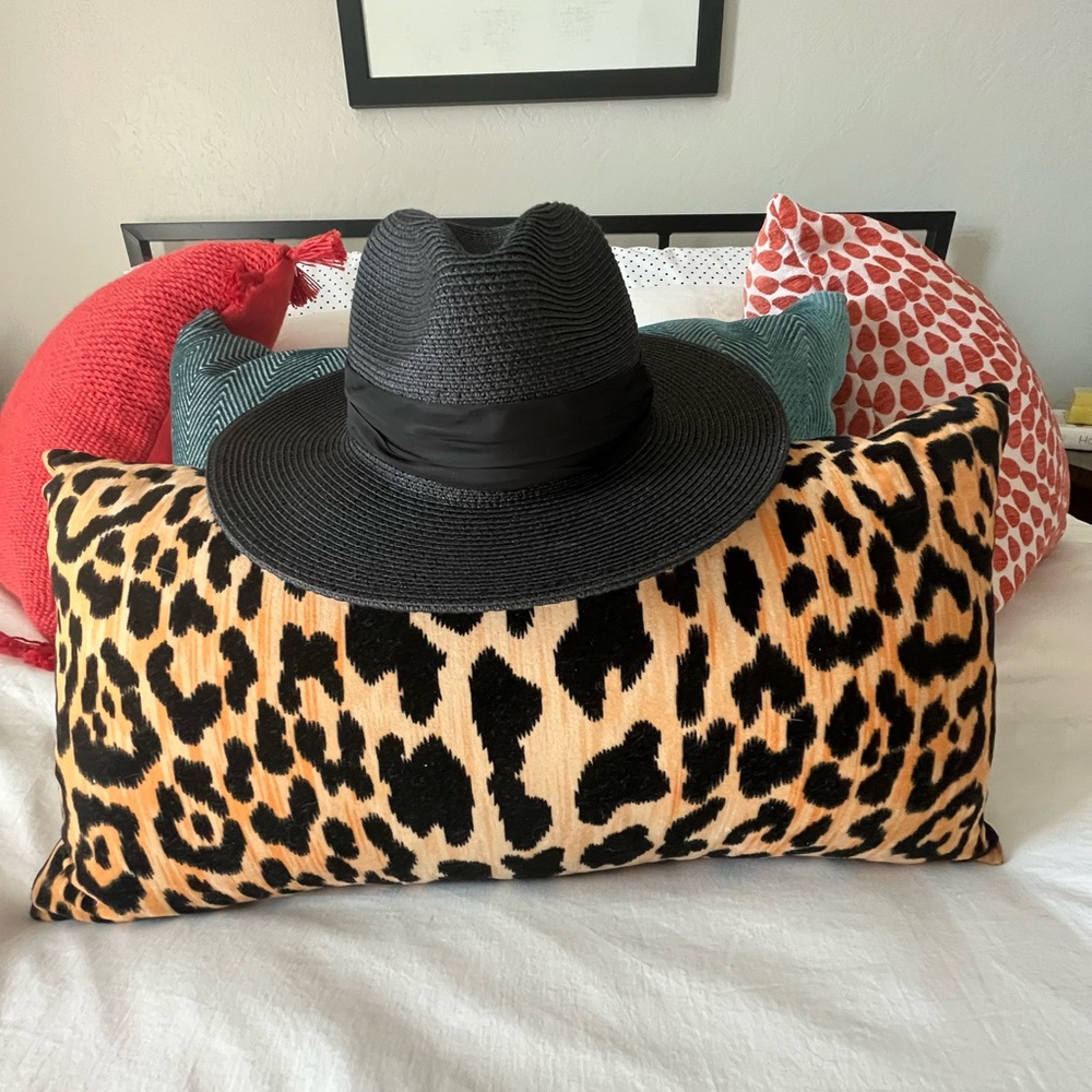 Women’s wide brim black Panama hat.
